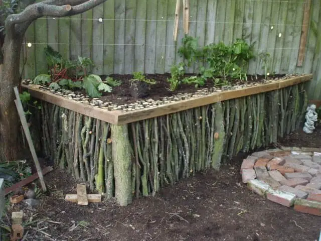 Raised natural wood garden bed