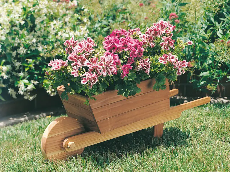 23-30. More wheelbarrow planter ideas