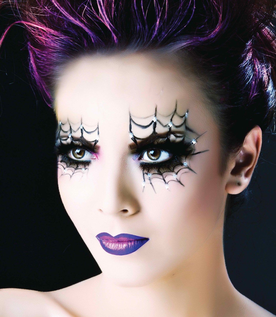 Girl with halloween makeup with cobwebs on her eyes