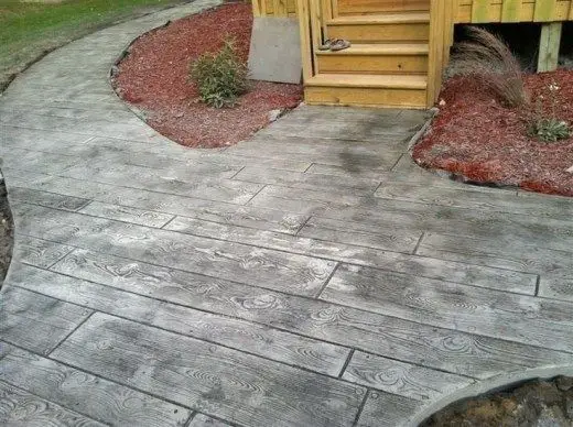 #4. Wood stamped concrete patio