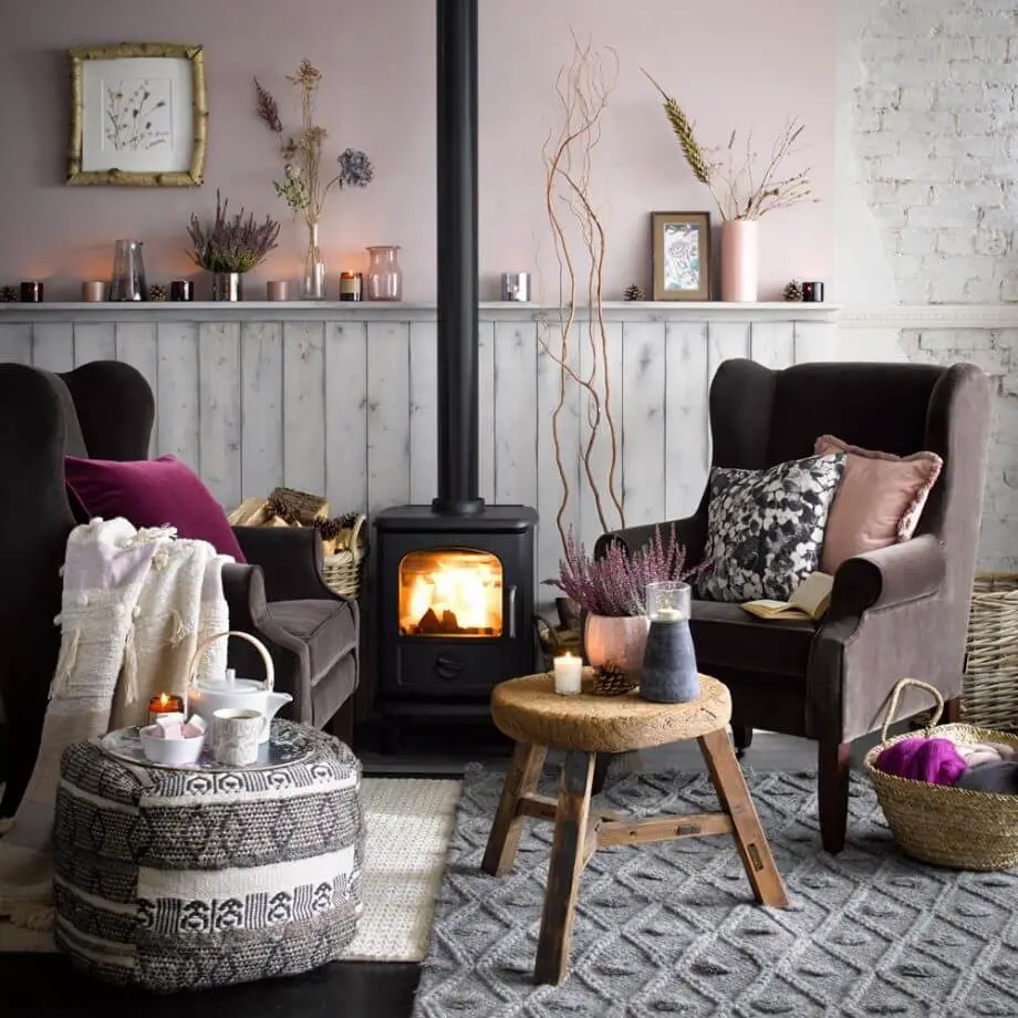 21). Pink living room with black fireplace