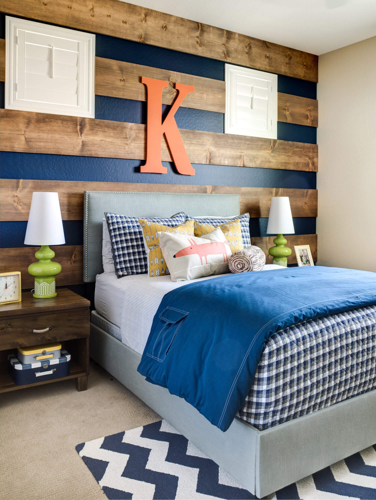 Large stained boards over a navy blue wall