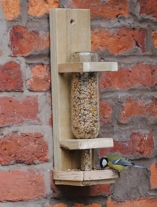 Wine bottle squirrel feeder