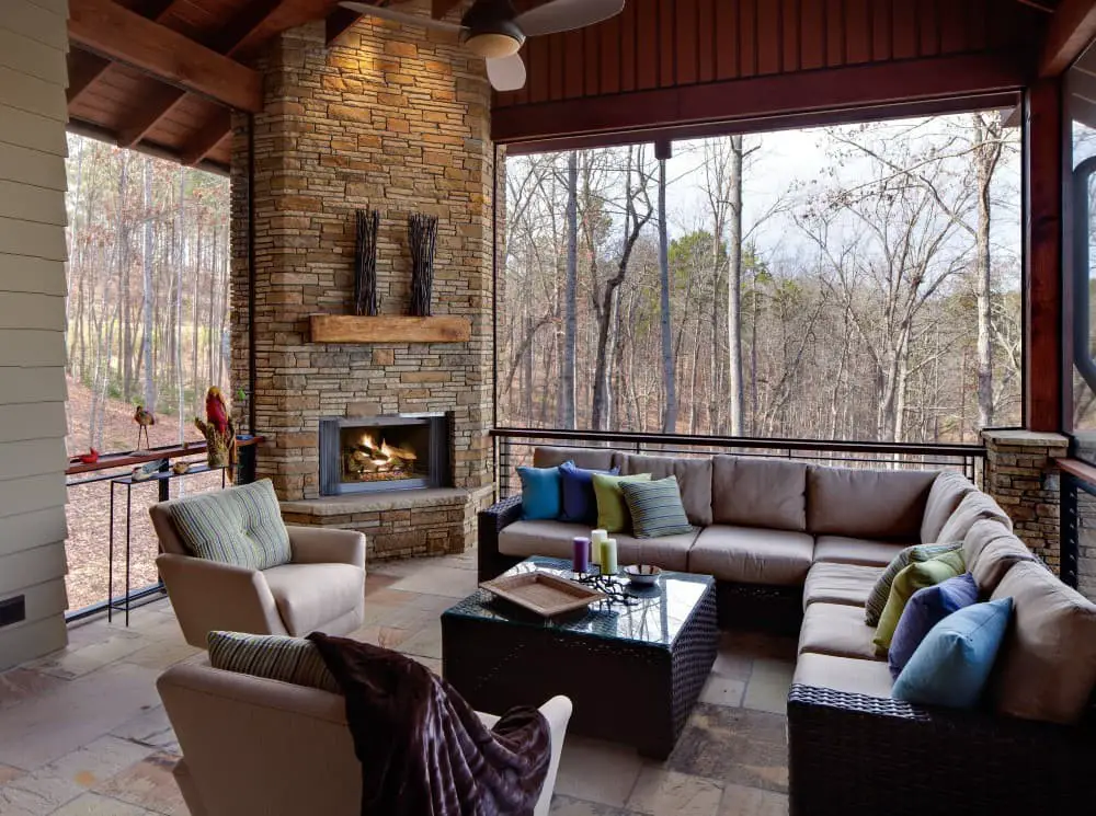 Screened in porch with corner fireplace ideas.