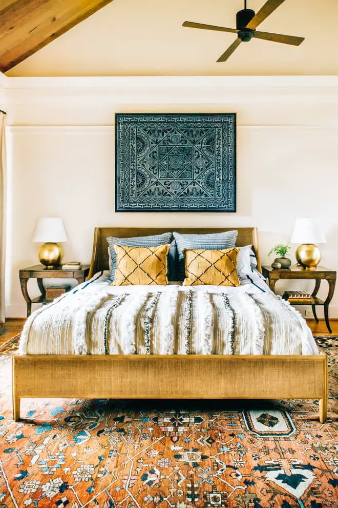 A large golden and white bedroom