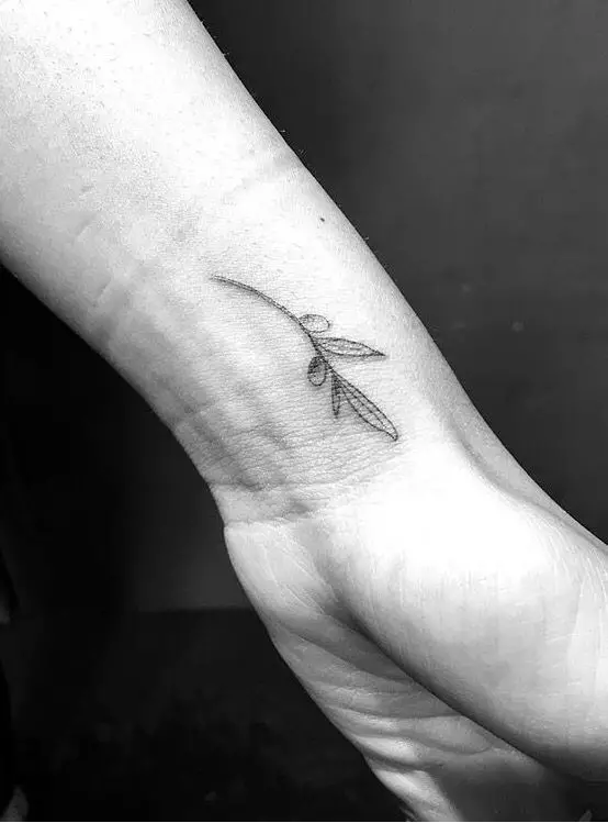 #4. The wrist olive branch tattoo.