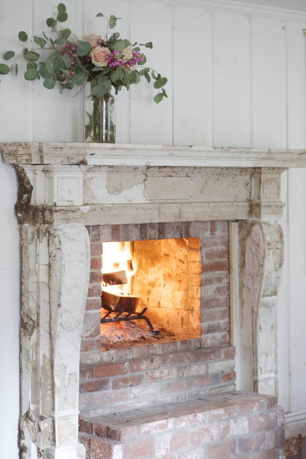 #1. Antique fireplace with flowers