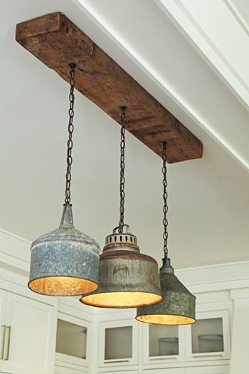 Rustic light fixture is made from old tin funnels