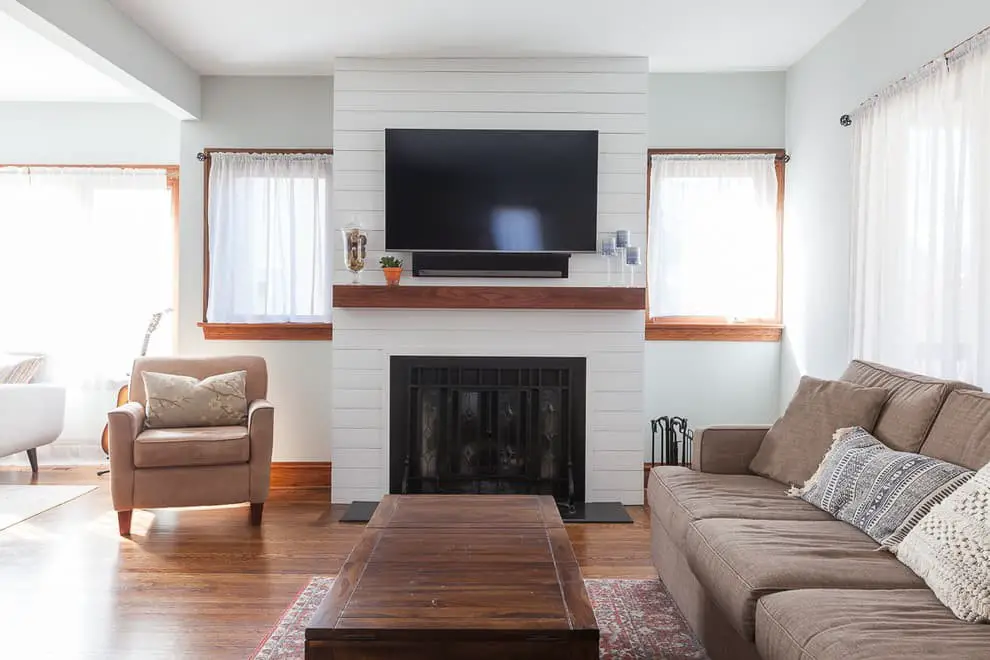 Shiplap accent wall ideas with TV and fireplace.