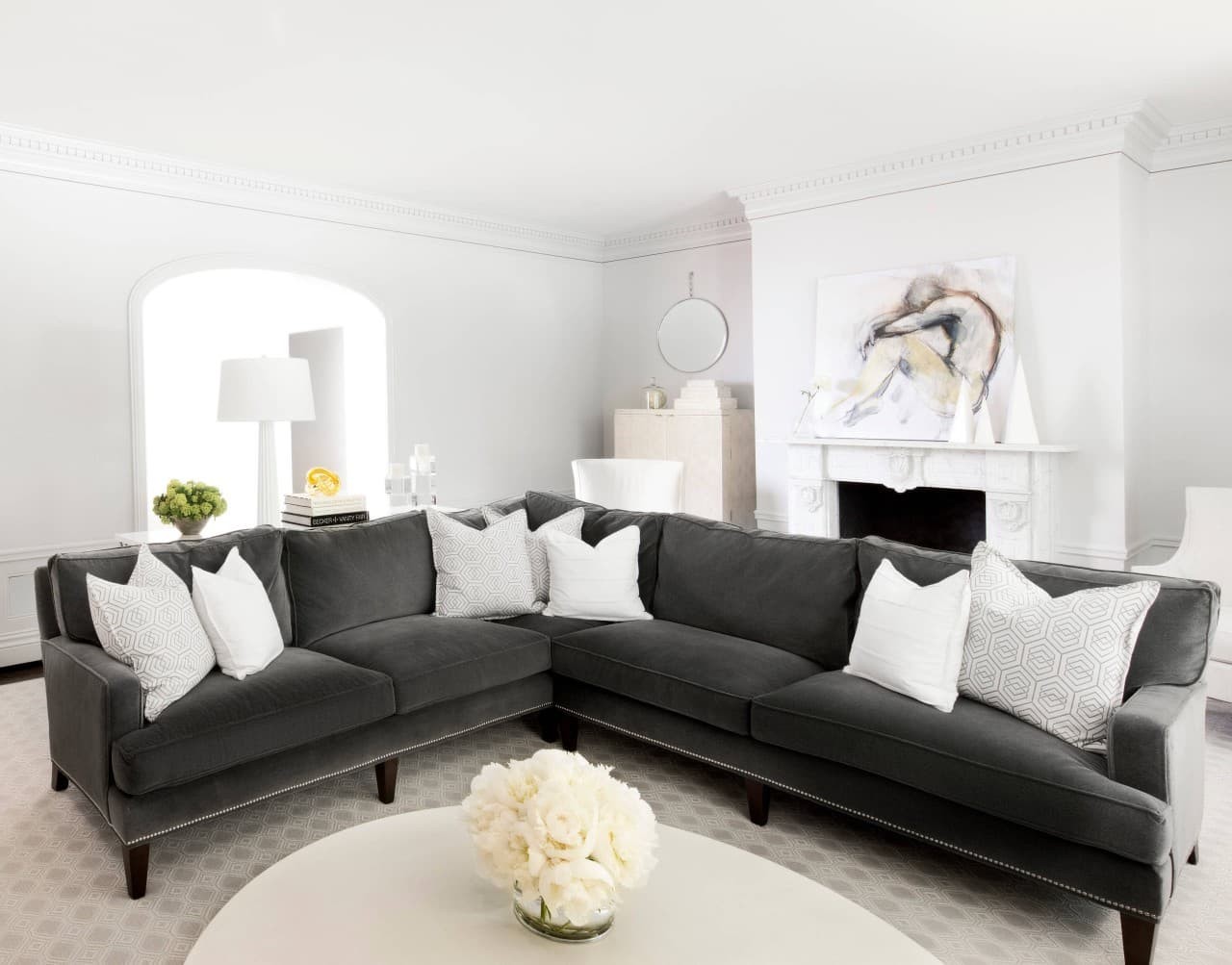 A crisp white wall against your black sofa