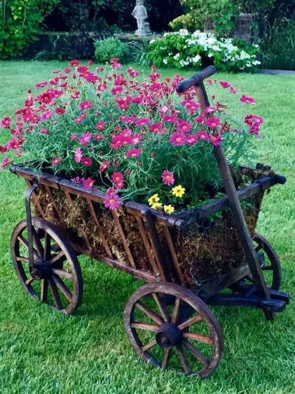 23-30. More wheelbarrow planter ideas