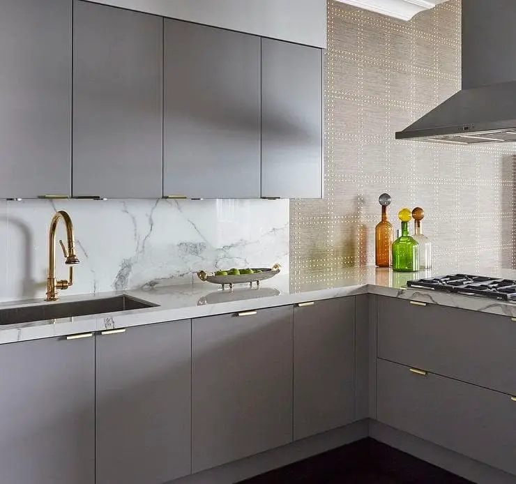 Gray cabinets on top of a kitchen peninsula