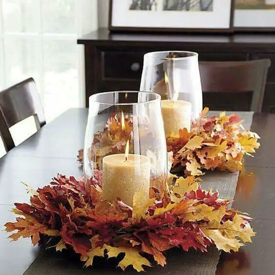 Wreath of colorful leaves provide the base for a pillar candle