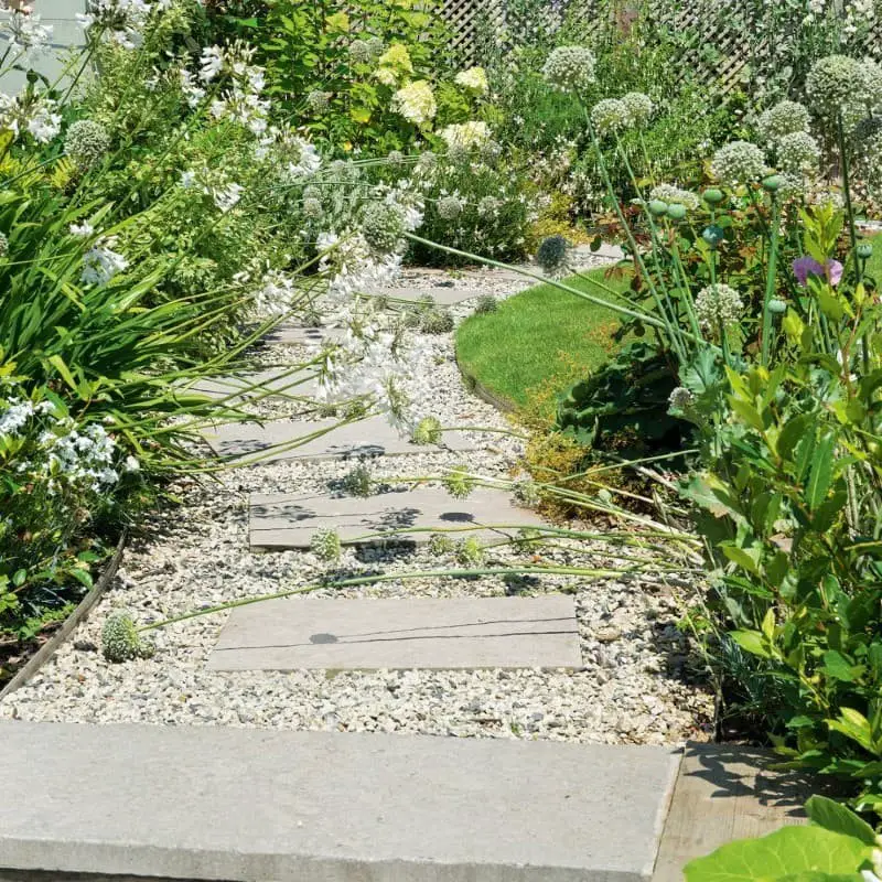 Lay slabs in pebbles for a low-cost, contemporary aesthetic.