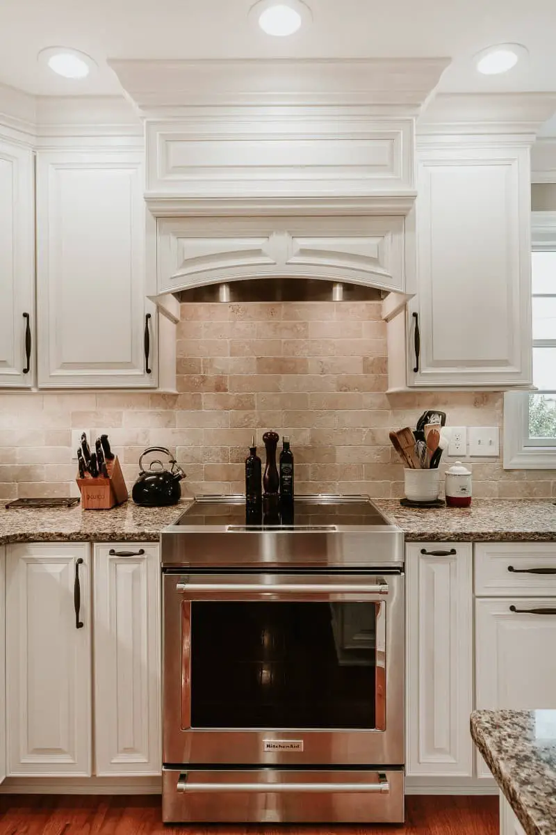 Backsplash ideas for white cabinets and brown granite countertops.