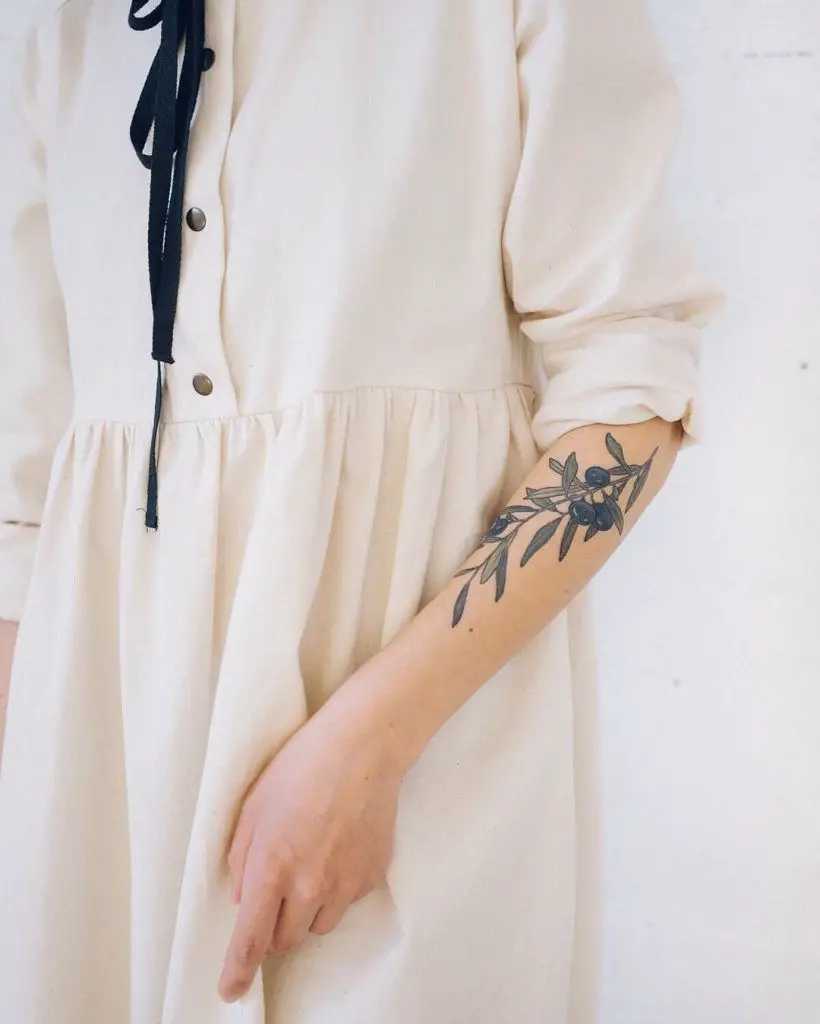 #5. The fore-arm olive branch tattoo.