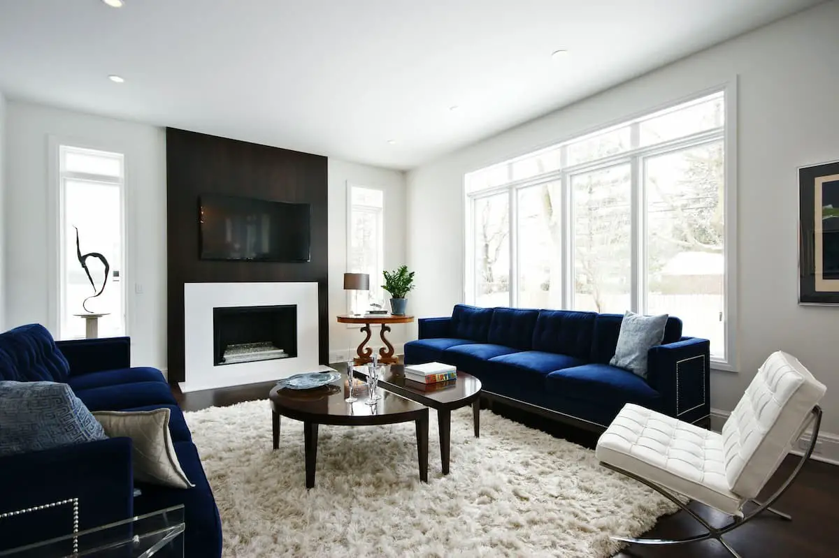 Calming blue couch living room with fireplace