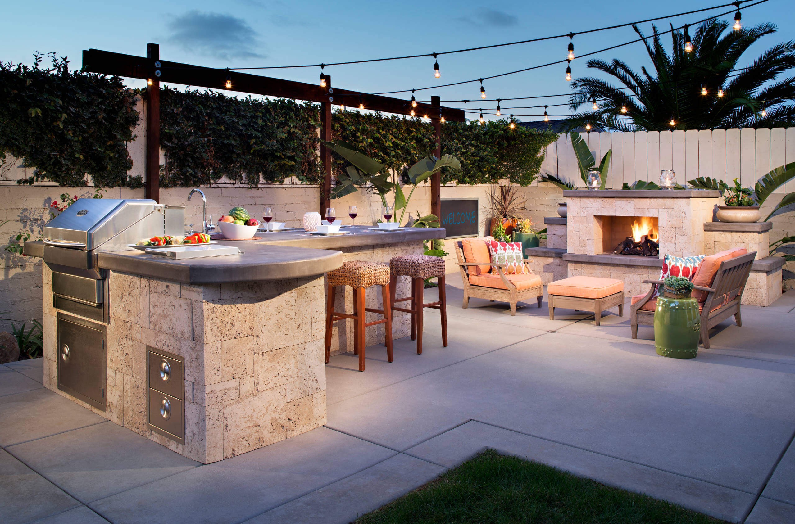 #14. Mid-sized tropical backyard concrete patio kitchen