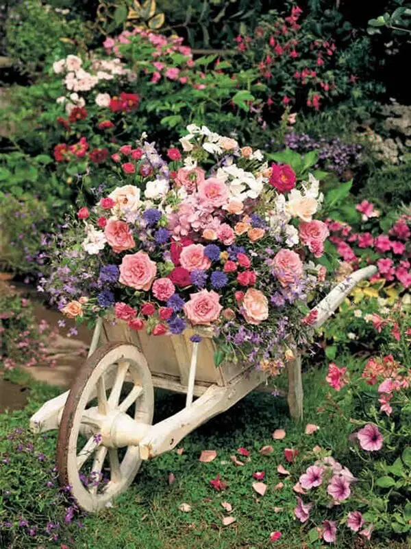 23-30. More wheelbarrow planter ideas