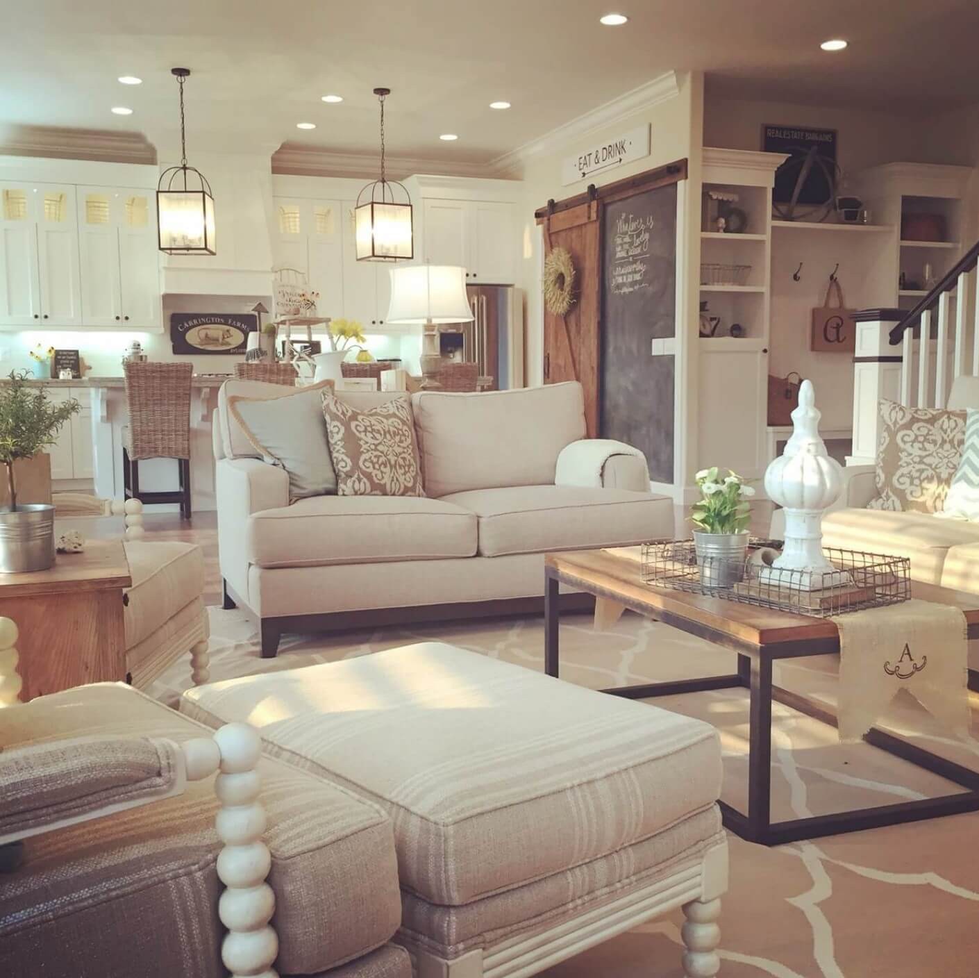 Neutral living room with sliding barn door and comfort sofa