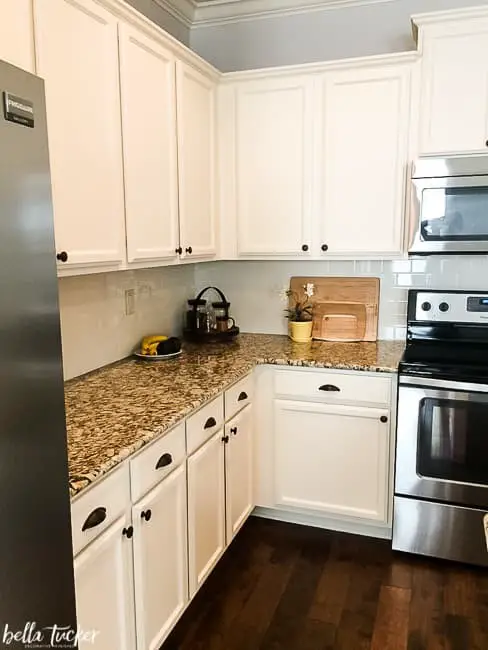 Backsplash ideas for white cabinets and brown granite countertops.