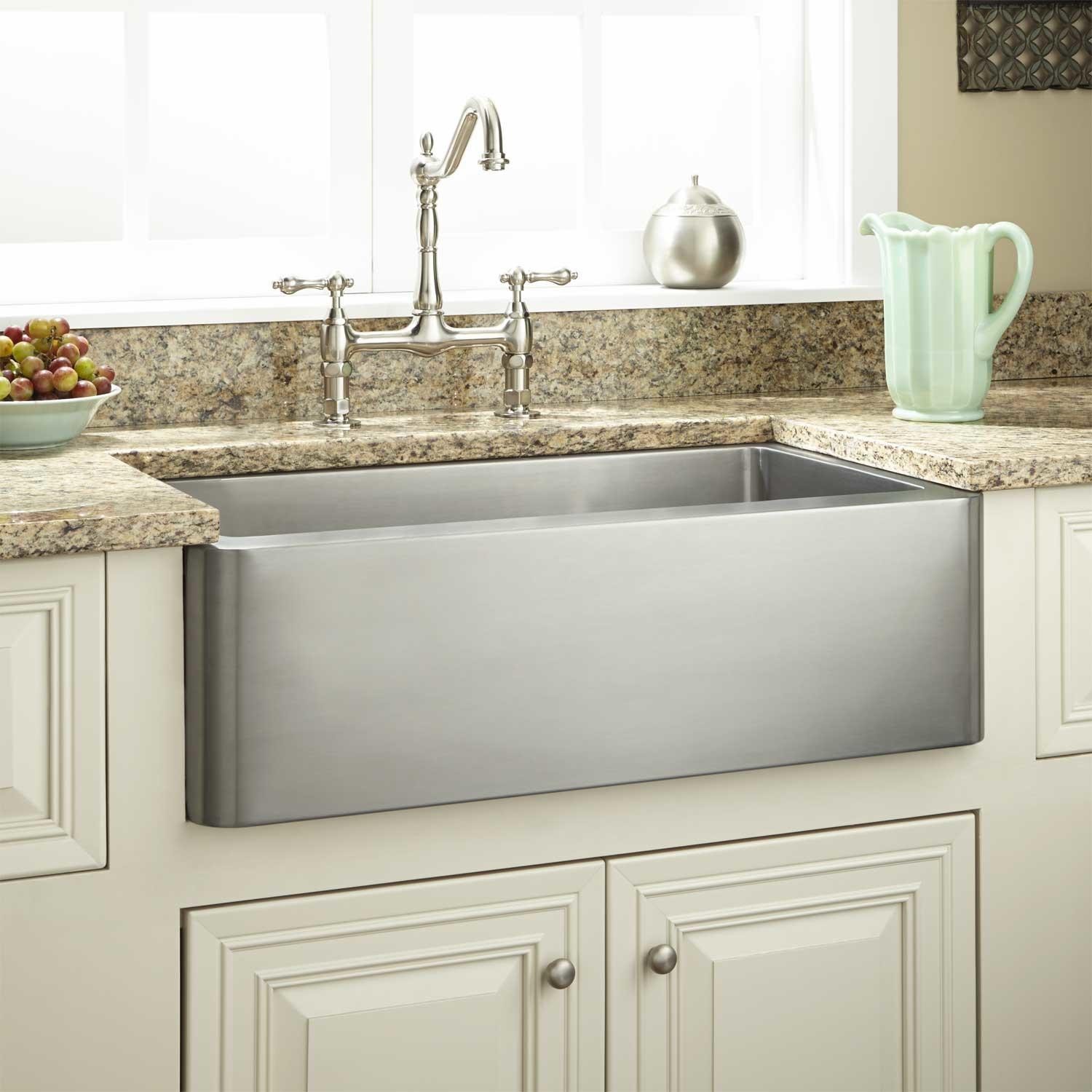 #12. Polished stone look Farmhouse styled sink