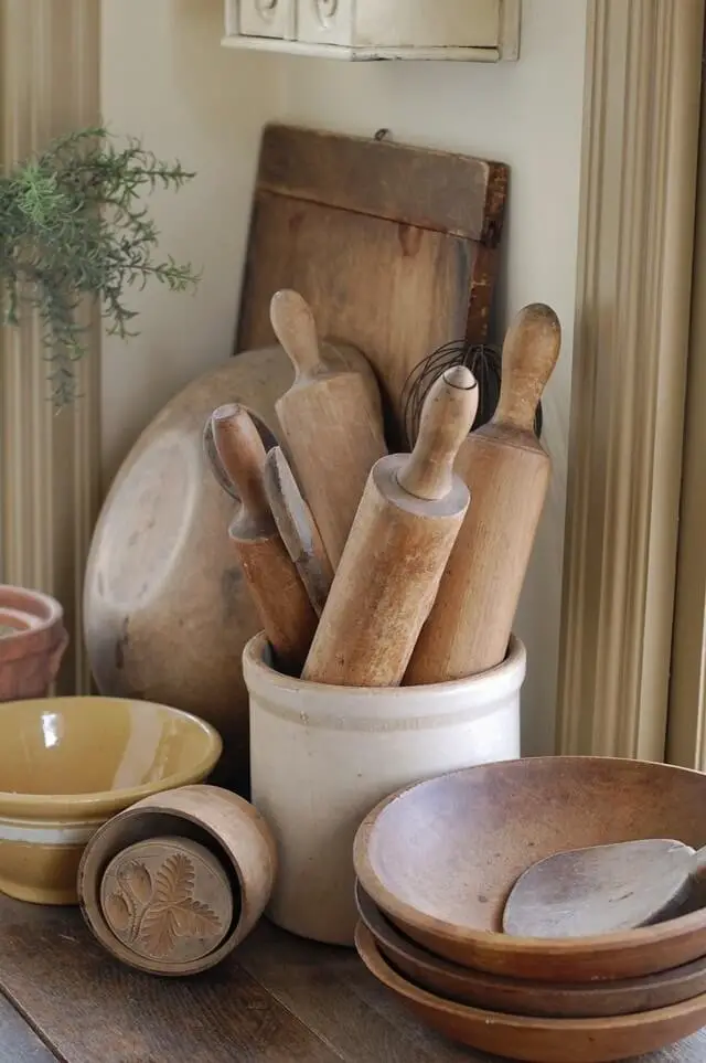 Wooden bowls, stoneware crocks full of rolling pins