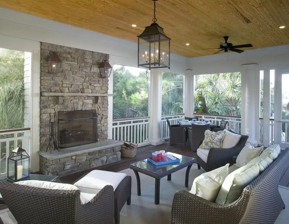 Screened in porch with stone fireplace ideas.