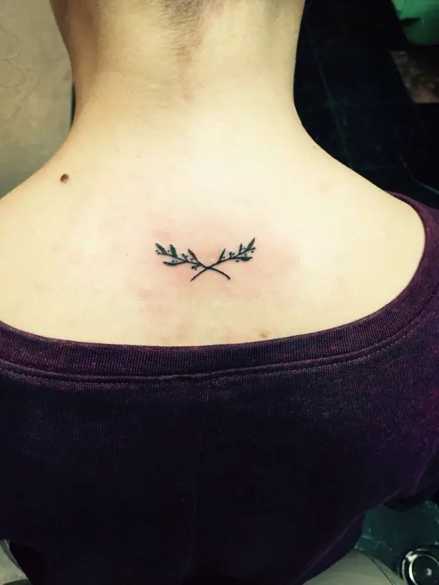 #10. The nape olive branch tattoo.