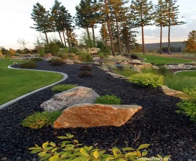 Basalt rock mulch on a backyard landscape