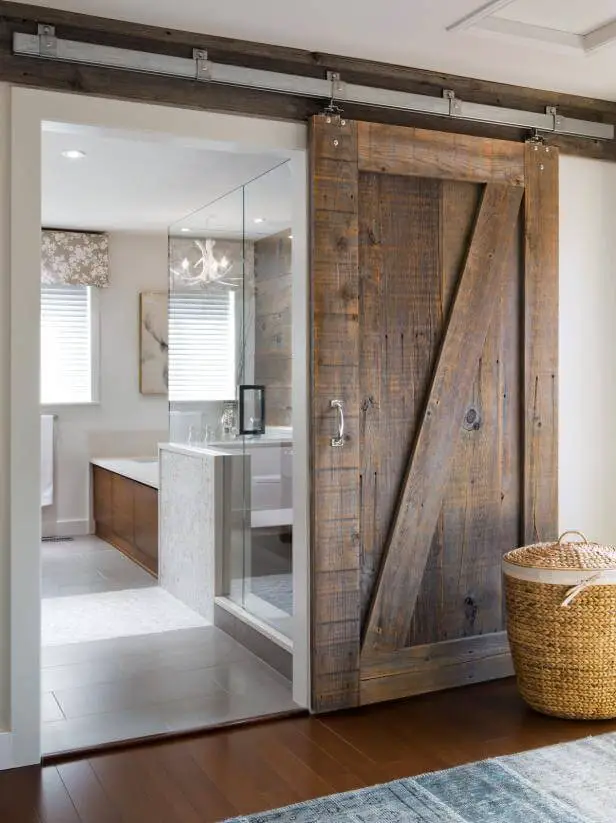 #17. Farmhouse sliding barn doors for bathroom