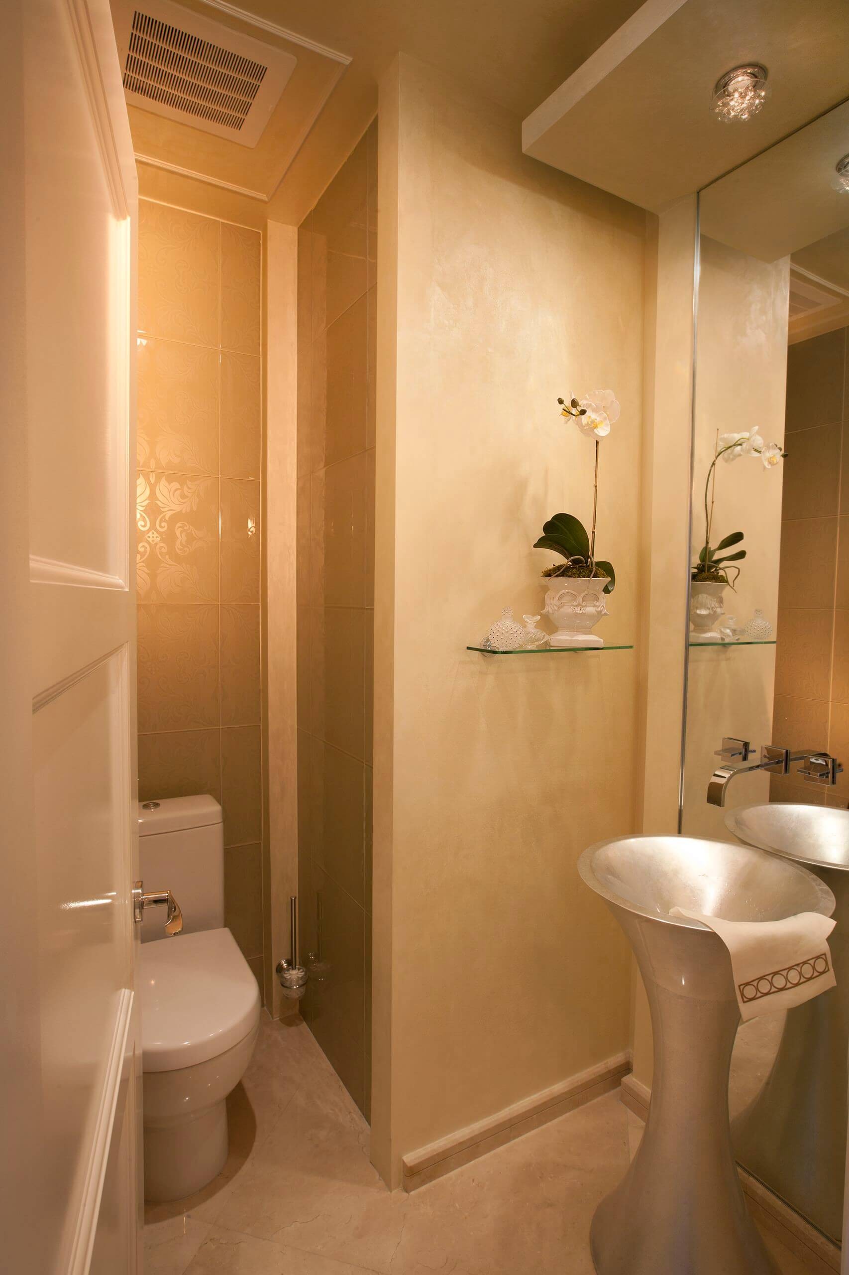 #17. Trendy powder room with a pedestal sink